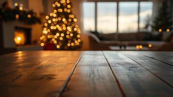 an empty wooden table in front of a christmas tree photo