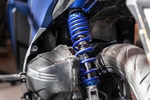 shock absorber of motorcycle in garage . back view photo