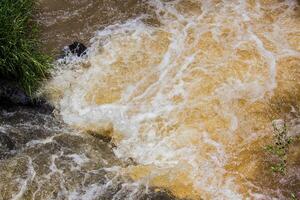 Detail of the force of the water at the edge of the Iguazu Falls, Misiones, Argentina photo
