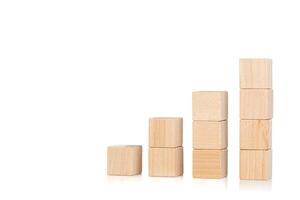 wooden cubes in the form of a ladder with a hand on an isolate white background photo