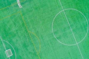 artificial grass soccer field after a training session, aerial top view with a drone photo