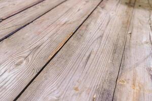 textured surface of an aged wooden table showcasing its rustic charm and craftsmanship, wooden planks background photo