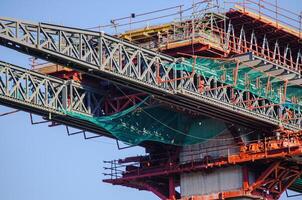 partial view of a bridge structure under construction, viaduct concept photo