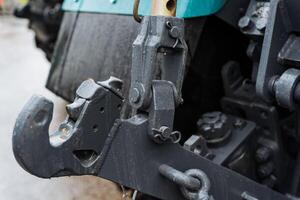 Close up of a hook on the rear bumper of a tractor photo