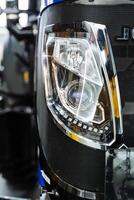 Closeup of tractor headlamp, part of automotive lighting photo