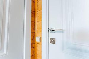 Close up of a home door with a wooden wall background photo