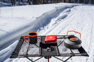 A set of camping equipment, camping in the forest, first aid kit for hiking, trekking in the forest. photo