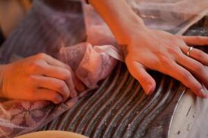 Closeup of hands on fabric, featuring gesture and thumb detail photo