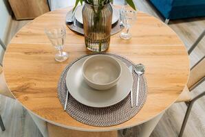 Stylish wooden tableware and decor set for your dining table photo