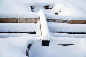 Work on the restoration of the pipeline in the urban environment, an emergency situation at the heating plant, sewerage under the snow. photo