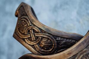 A close up of a wooden viking helmet photo