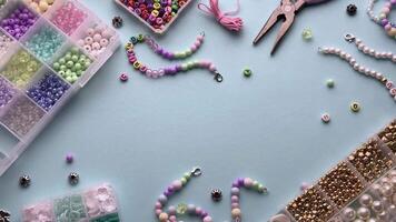 Crafting colorful bracelets with beads and tools on a table video