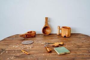 carpenter's workplace, carpentry workshop, woodcarving tools on the table, chisel photo