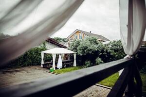 A view of a backyard from a window photo