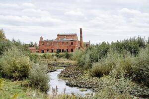 Old abandoned brick factory. Ancient architecture. construction of the last century. Destroyed building. photo