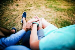 Close-up of a woman and a man holding out their hands, two people holding hands. The symbol is a sign of sincere feelings, a loved one. the concept of true friendship, outdoors photo