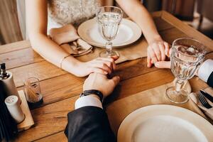Close-up of a woman and a man holding out their hands, two people holding hands. The symbol is a sign of sincere feelings, a loved one. the concept of true friendship, outdoors photo