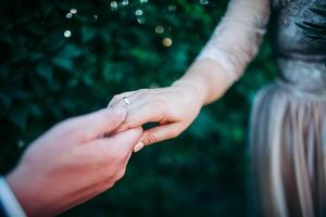 Close-up of a woman and a man holding out their hands, two people holding hands. The symbol is a sign of sincere feelings, a loved one. the concept of true friendship, outdoors photo