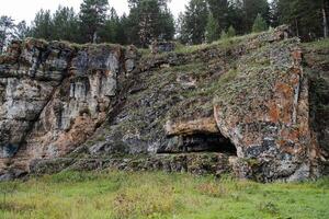 rock mass, river flows at the foot of the rocky mountains, white stone rocks, nature of Russia, southern Urals, Yuryuzan river, travel idea photo