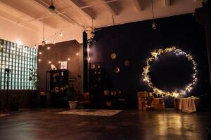 A room with a circular light fixture and a large wall photo