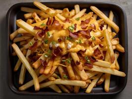 french fries with crispy bacon and cheese topping photo