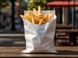 A paper bag of full french fries. photo