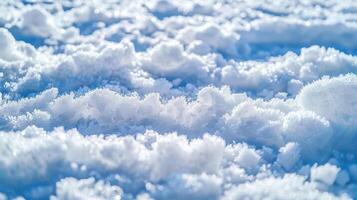Close-up of fresh, white snow with a light blue background. photo