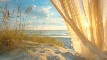 A view of the ocean through a sheer curtain, with golden sunlight and seagrass in the foreground. photo