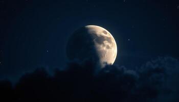 The moon is seen in the night sky with clouds photo