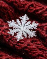 Intricate snowflake on a red background photo