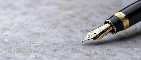 close up of a fountain pen nib on a textured surface photo