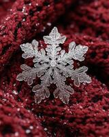 Intricate snowflake crystal on red background photo