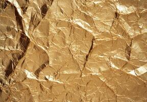 Crumpled golden foil texture background photo