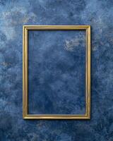 empty golden frame on blue textured background photo
