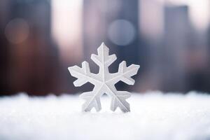 Intricate snowflake on snowy surface photo