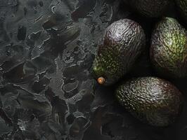 Ripe avocados on a dark background photo