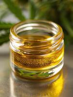 Close up of golden honey in glass jar photo