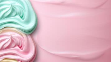 Pastel colored swirls of marshmallow fluff on a pink background photo
