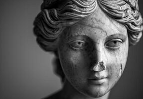 Weathered stone statue face with intricate details photo