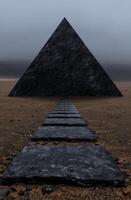 Mysterious black pyramid in the desert photo