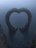 heart shaped rock formation in misty lake photo