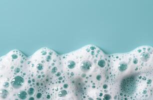Soapy bubbles on a teal background photo