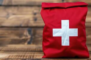 first aid kit on wooden background photo