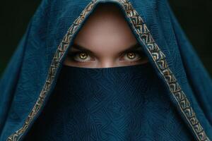 mysterious woman in blue and gold veil photo