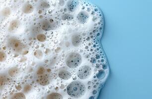 close up of soapy bubbles on a blue background photo