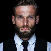 serious businessman with beard and blue eyes photo