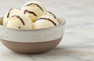 Delicious vanilla ice cream scoops with chocolate syrup drizzle photo