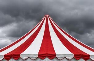 Vibrant circus tent against stormy sky photo