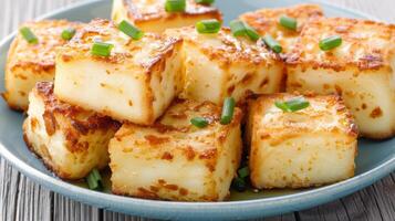 Delicious baked potato casserole with cheese and green onions photo