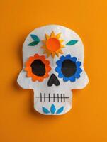 colorful paper sugar skull on orange background photo